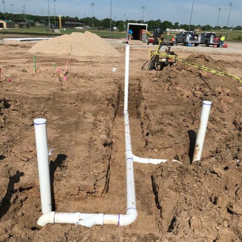 plumbing-system-pipes-in-ground-workers-trucks-hutchinson-ks